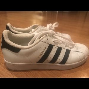 white adidas shoes with black stripes